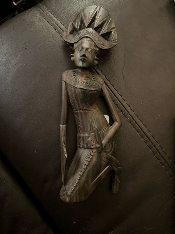 Teak hand-carved statue of Kali goddess of Bali island
